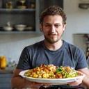 Client Adi N. with a healthy meal